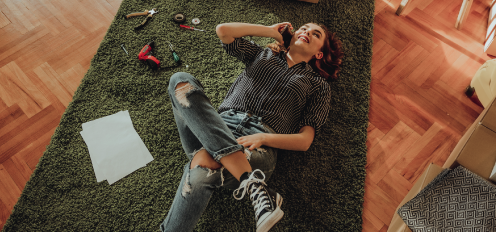 girl resting on carpet after renovation